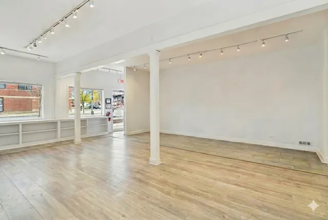 a view of a livingroom with wooden floor