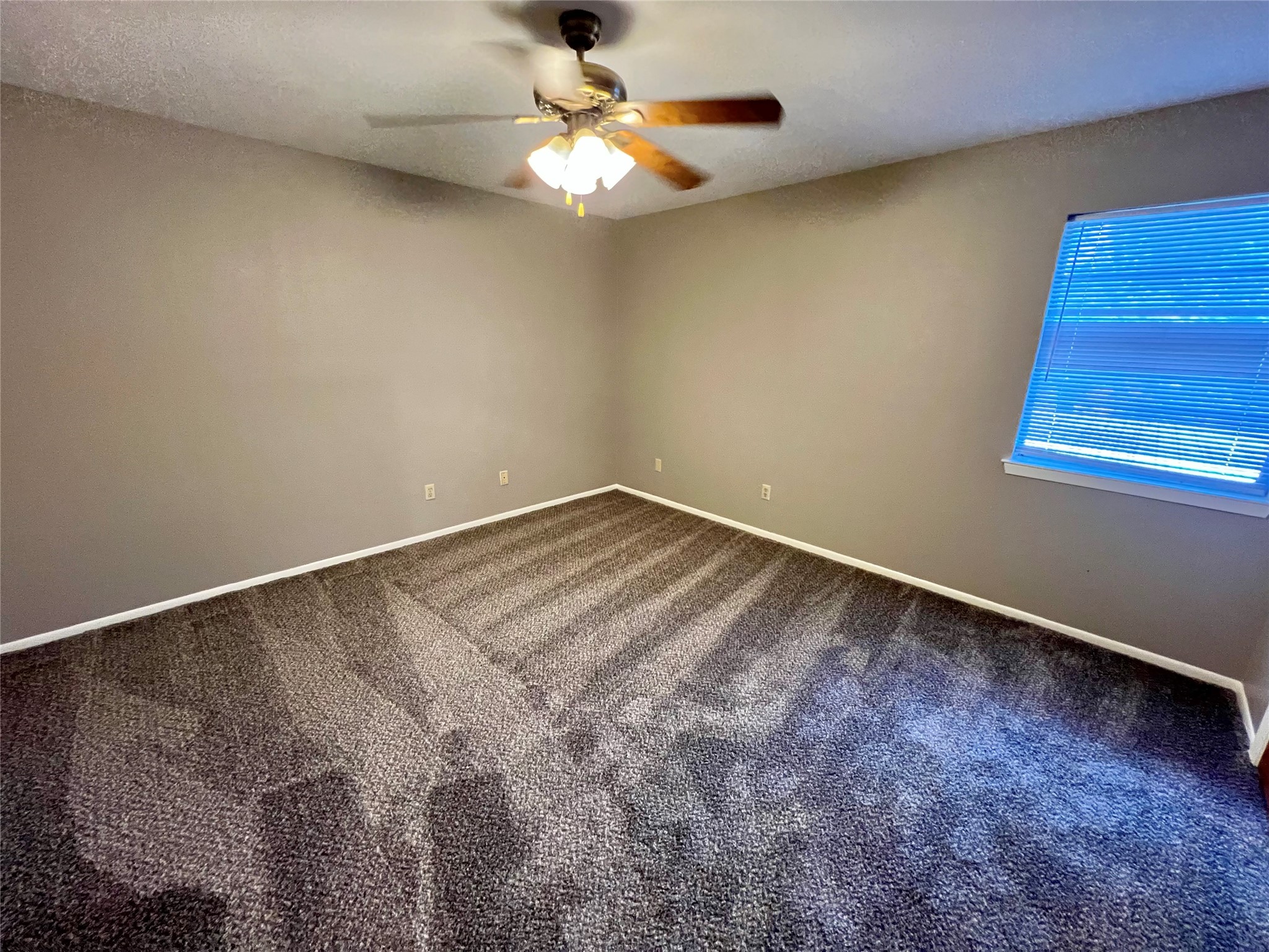1039-1045 North Chenango Street Angleton, TX 77515 - Photo 12 of 17 a view of room with window and ceiling fan