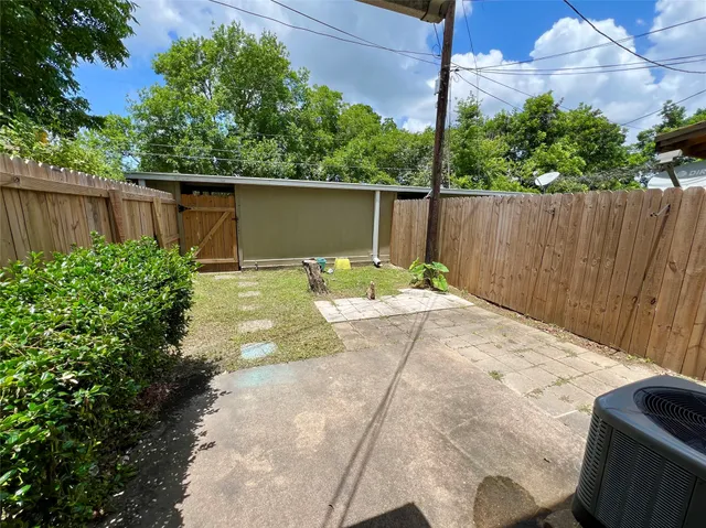 a backyard of a house with lots of green space