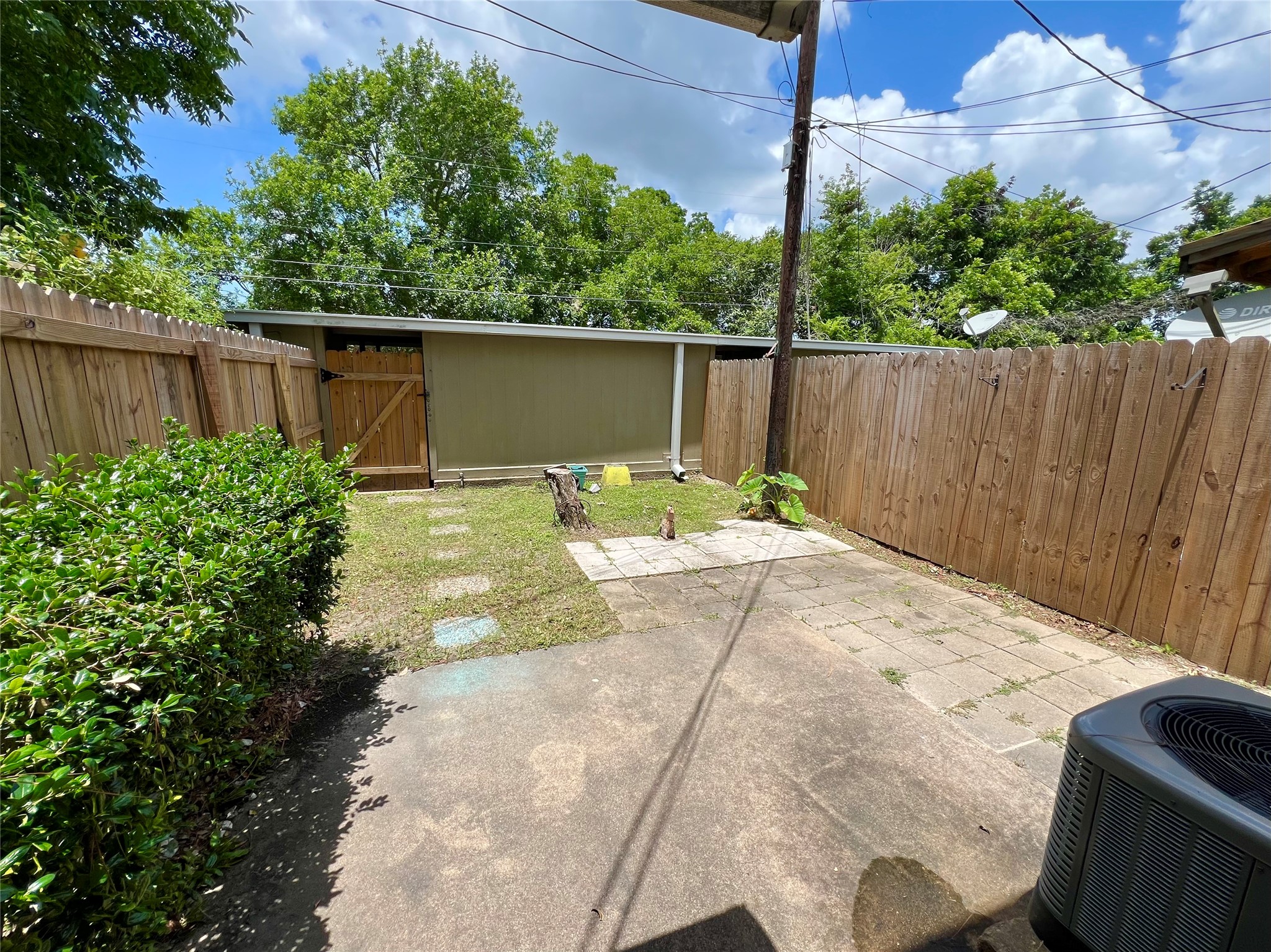 1039-1045 North Chenango Street Angleton, TX 77515 - Photo 14 of 17 a backyard of a house with lots of green space