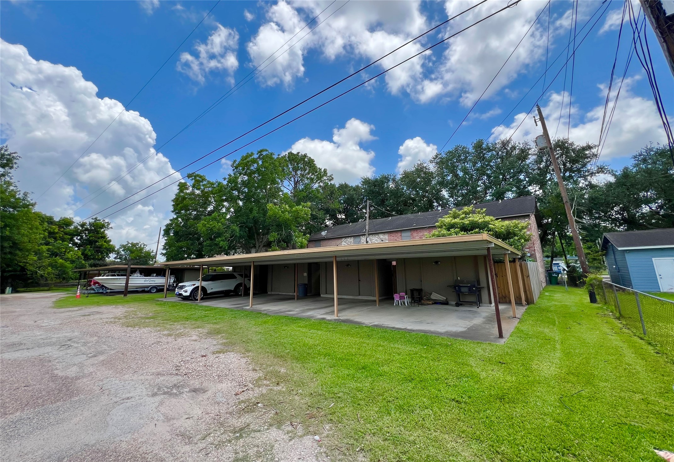 1039-1045 North Chenango Street Angleton, TX 77515 - Photo 17 of 17 a view of a house with a yard