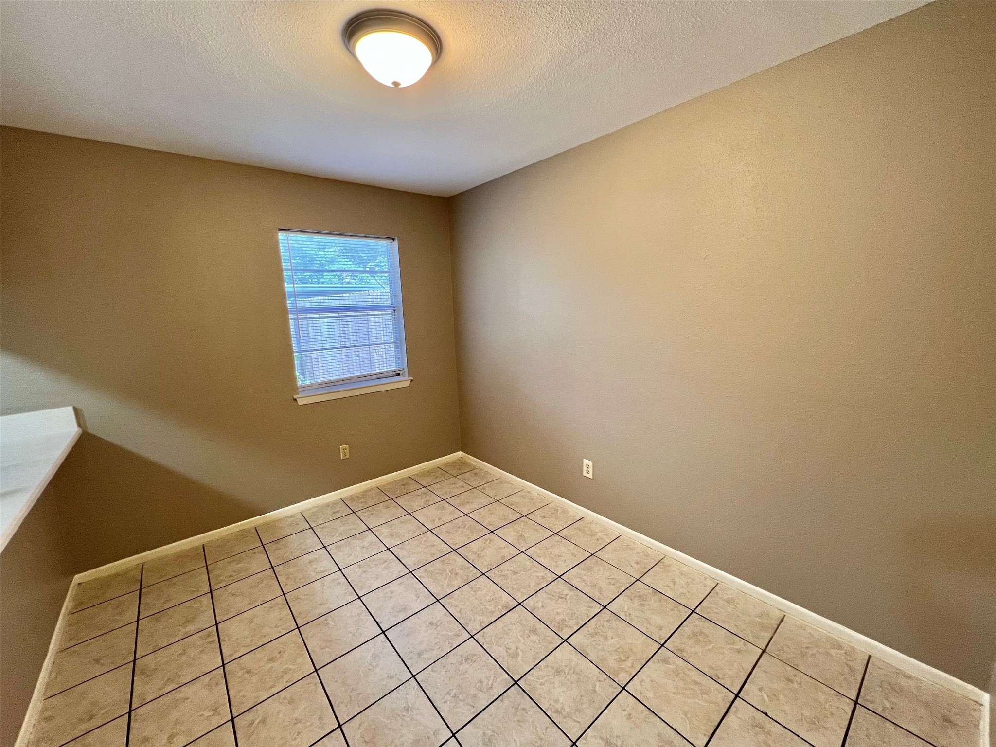 1039-1045 North Chenango Street Angleton, TX 77515 - Photo 7 of 17 a view of an empty room and window