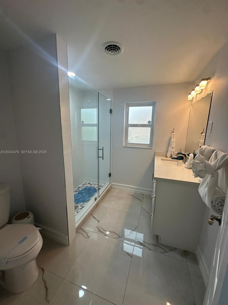 2212 Club House Road North Fort Myers, FL 33917 - Photo 18 of 40 a bathroom with a sink toilet and shower