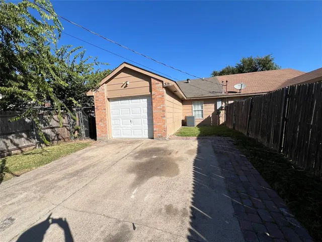 a view of wooden house with a bench in front of it