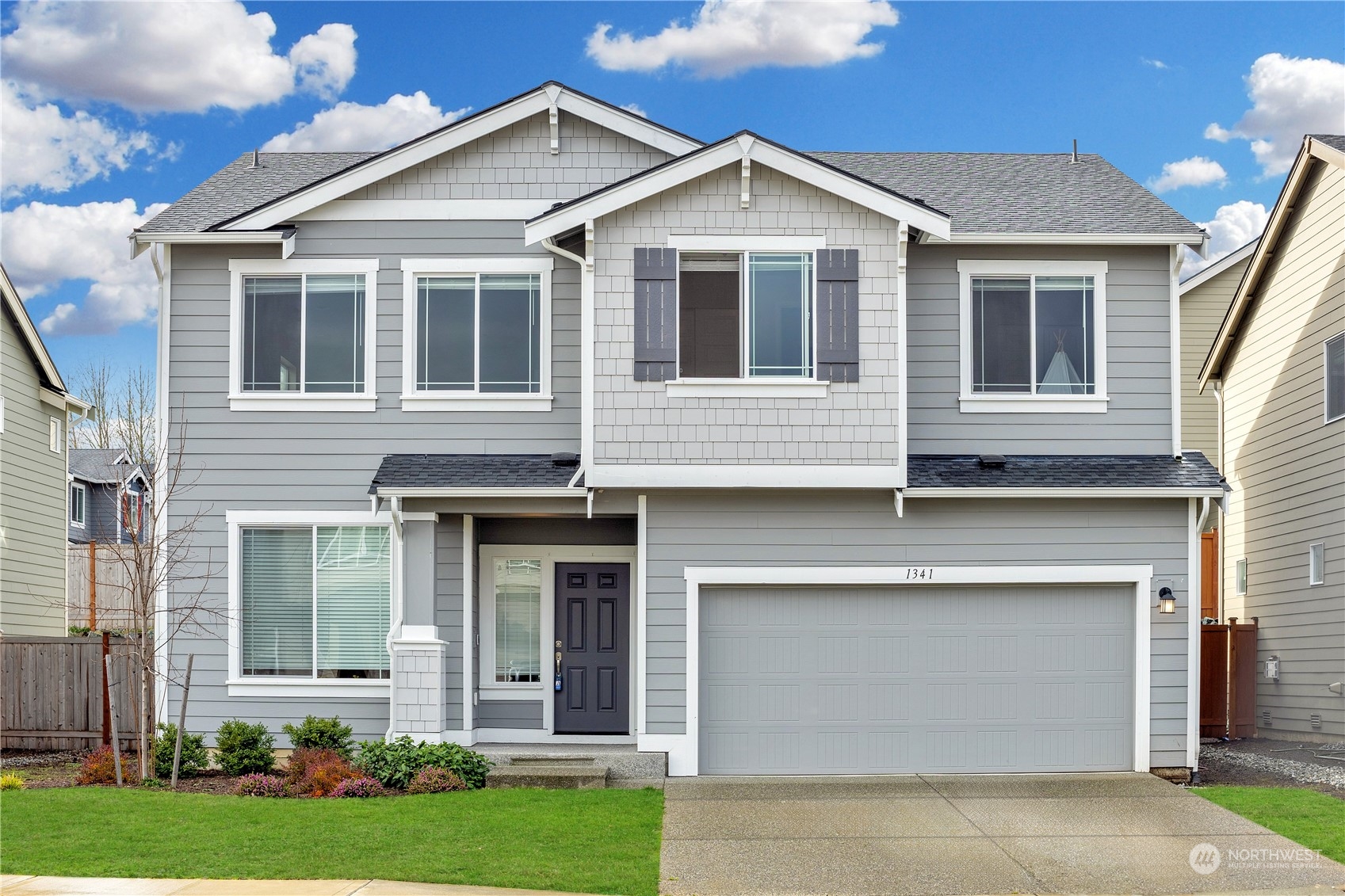 a front view of a house with garden