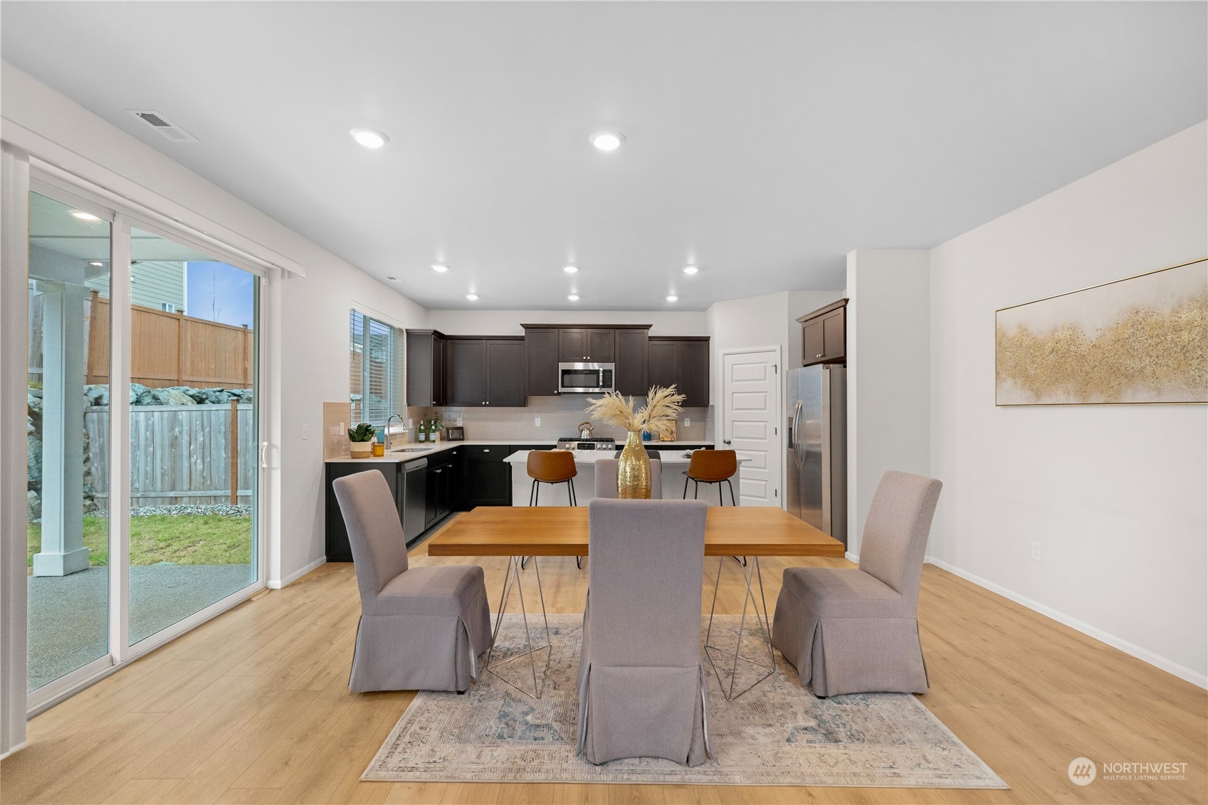 1341 Cascade Street Sultan, WA 98294 - Photo 11 of 39 a dining room with furniture a large window and a table