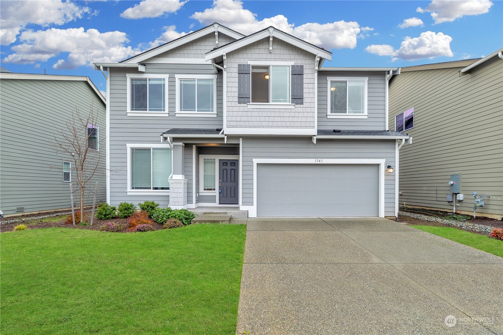 1341 Cascade Street Sultan, WA 98294 - Photo 34 of 39 a front view of a house with a garden and plants