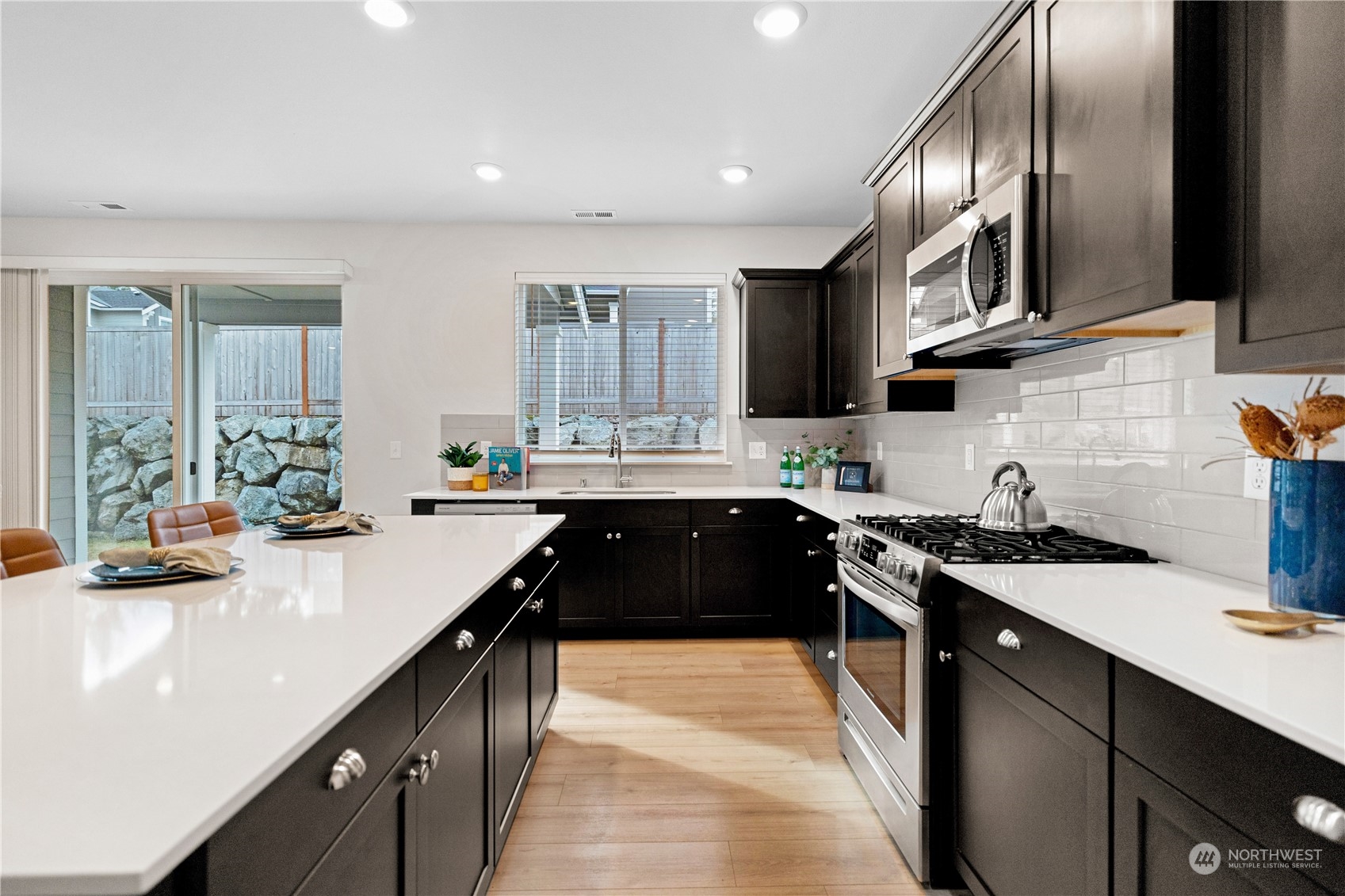 1341 Cascade Street Sultan, WA 98294 - Photo 6 of 39 a kitchen with granite countertop a sink stove and cabinets