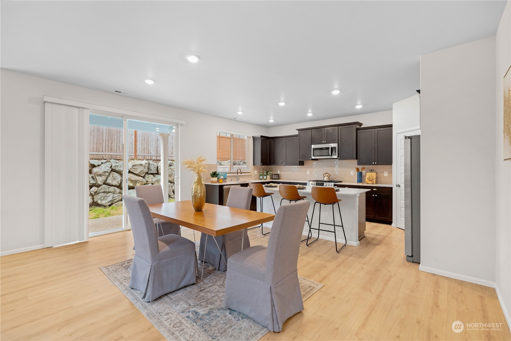 1341 Cascade Street Sultan, WA 98294 - Photo 9 of 39 a large kitchen with a table and chairs