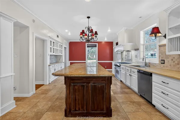 a view of kitchen with granite countertop breakfast area