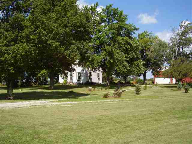 a view of a yard with swimming pool