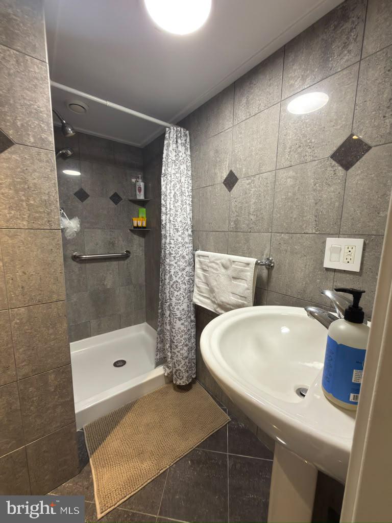 6801 Old Chesterbrook Road McLean, VA 22101 - Photo 29 of 30 Modern bathroom with sleek tiles.