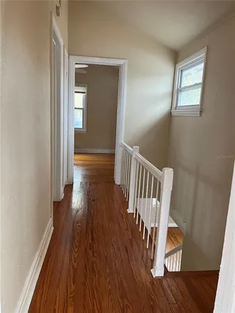 a view of entryway with wooden floor
