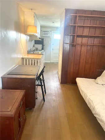 a bed room with a bed and cabinets