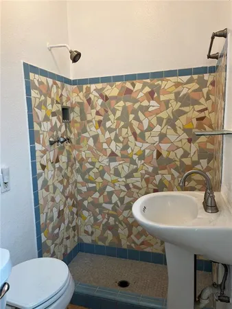 a bathroom with a sink and toilet