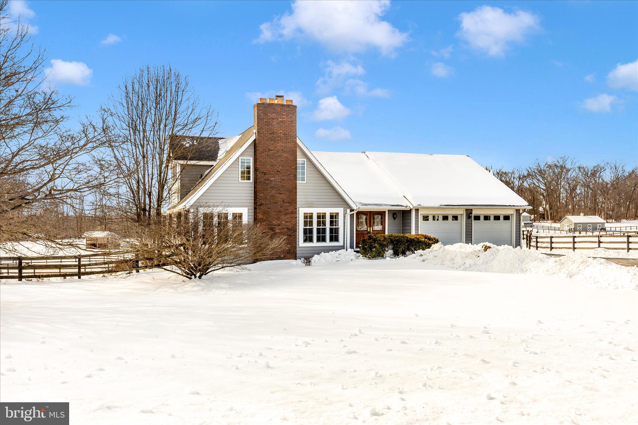 a view of a house with a snow in the yard