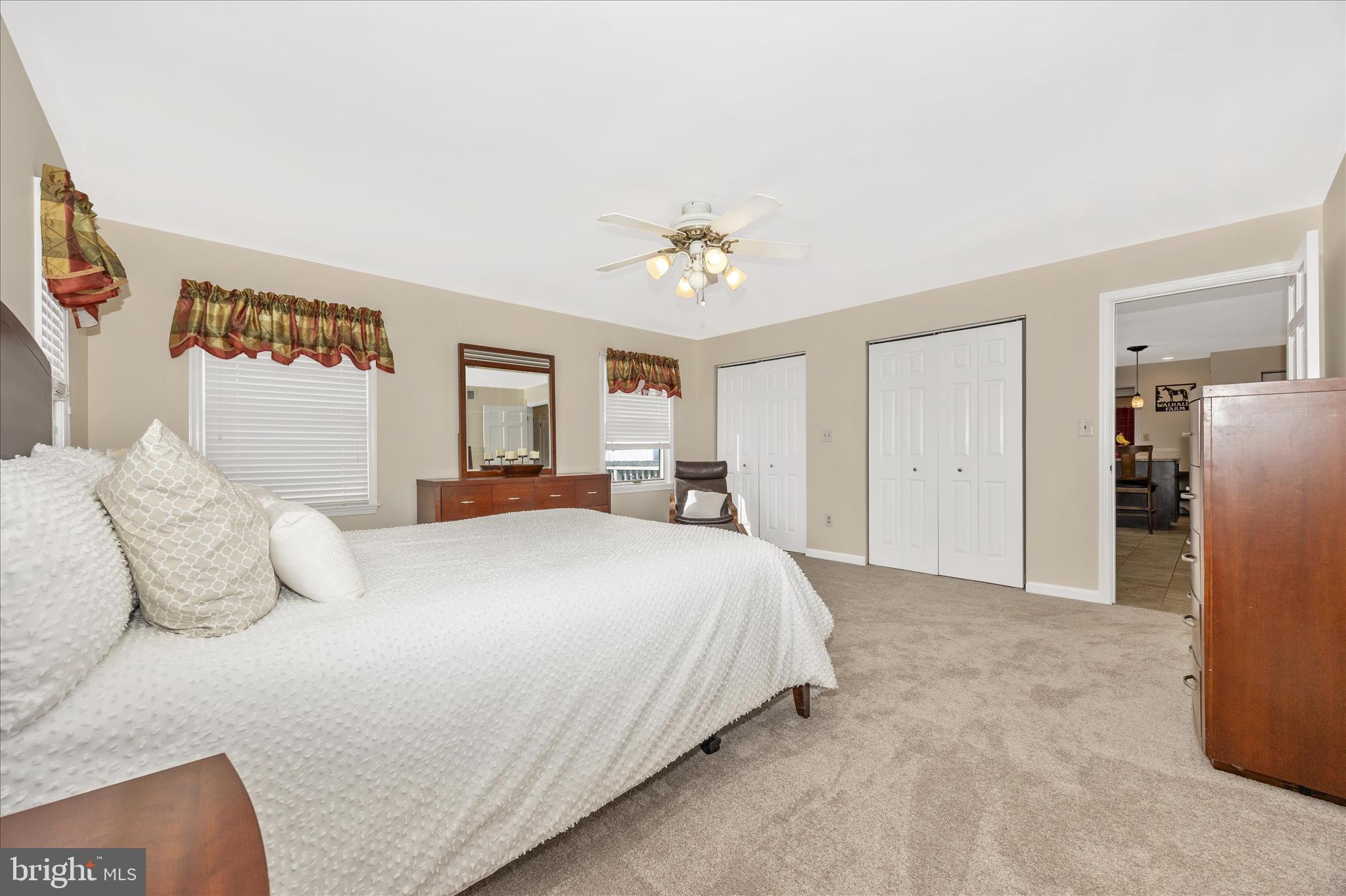 3340 Florence Road Woodbine, MD 21797 - Photo 15 of 61 a bedroom with a large bed and a chandelier