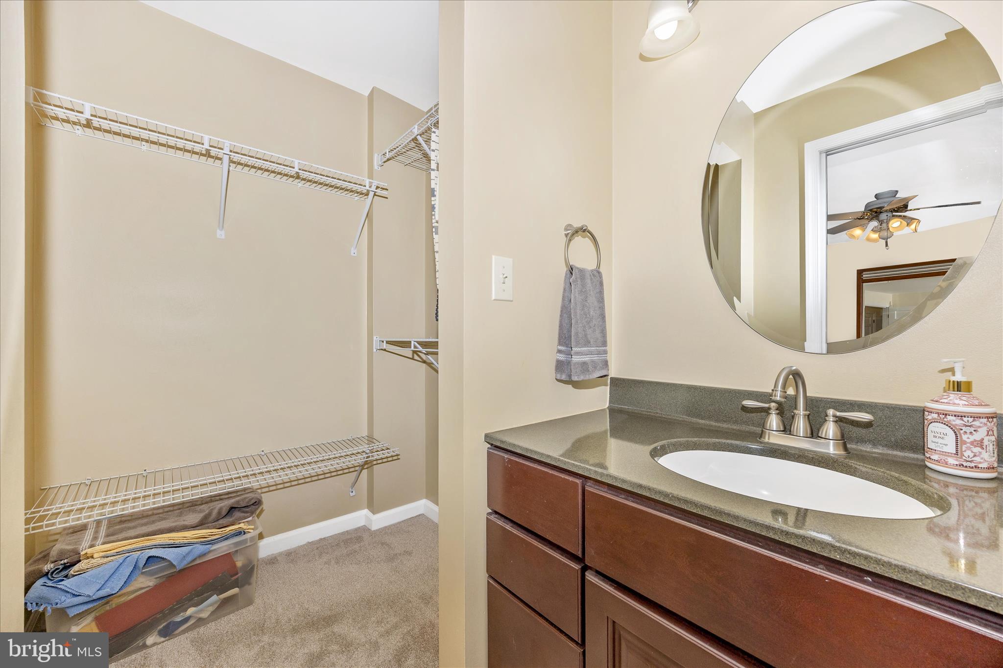 3340 Florence Road Woodbine, MD 21797 - Photo 17 of 61 a bathroom with a granite countertop sink a mirror a vanity and shower
