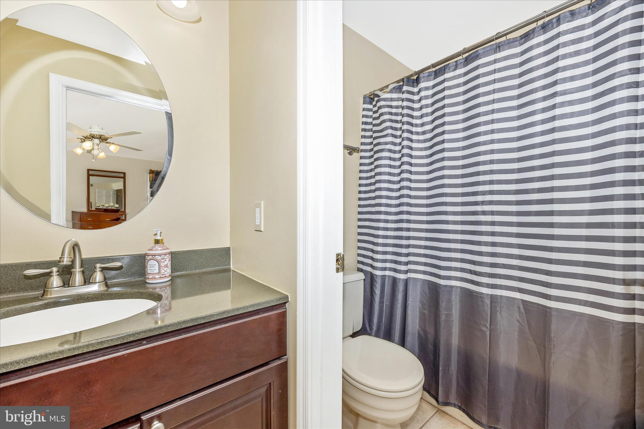 3340 Florence Road Woodbine, MD 21797 - Photo 18 of 61 a bathroom with a granite countertop sink toilet and mirror