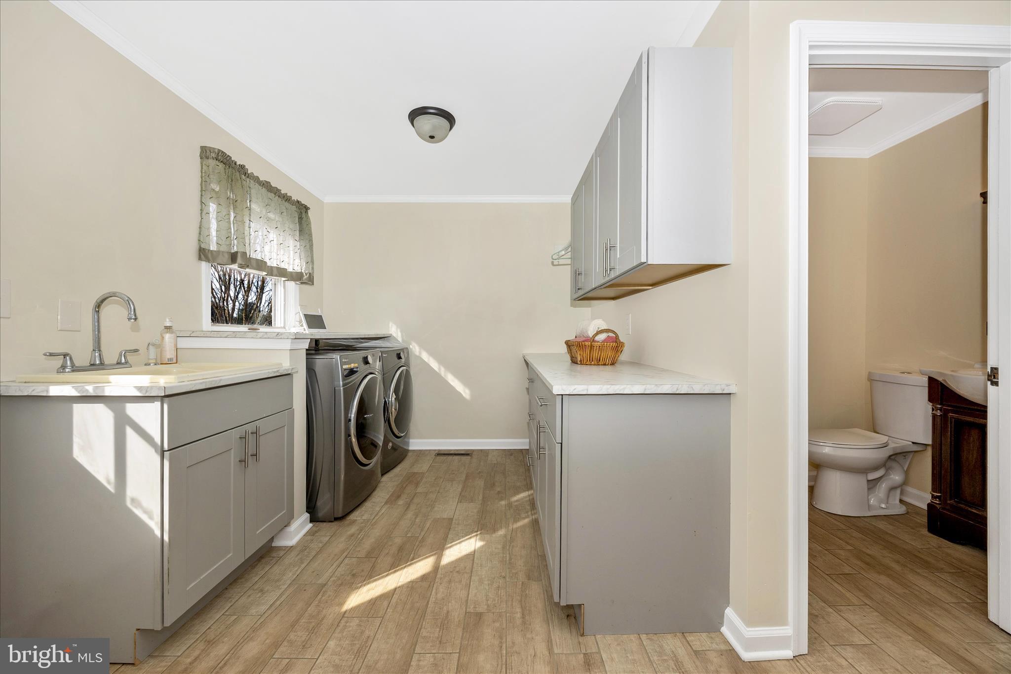 3340 Florence Road Woodbine, MD 21797 - Photo 19 of 61 a utility room with sink dryer and washer