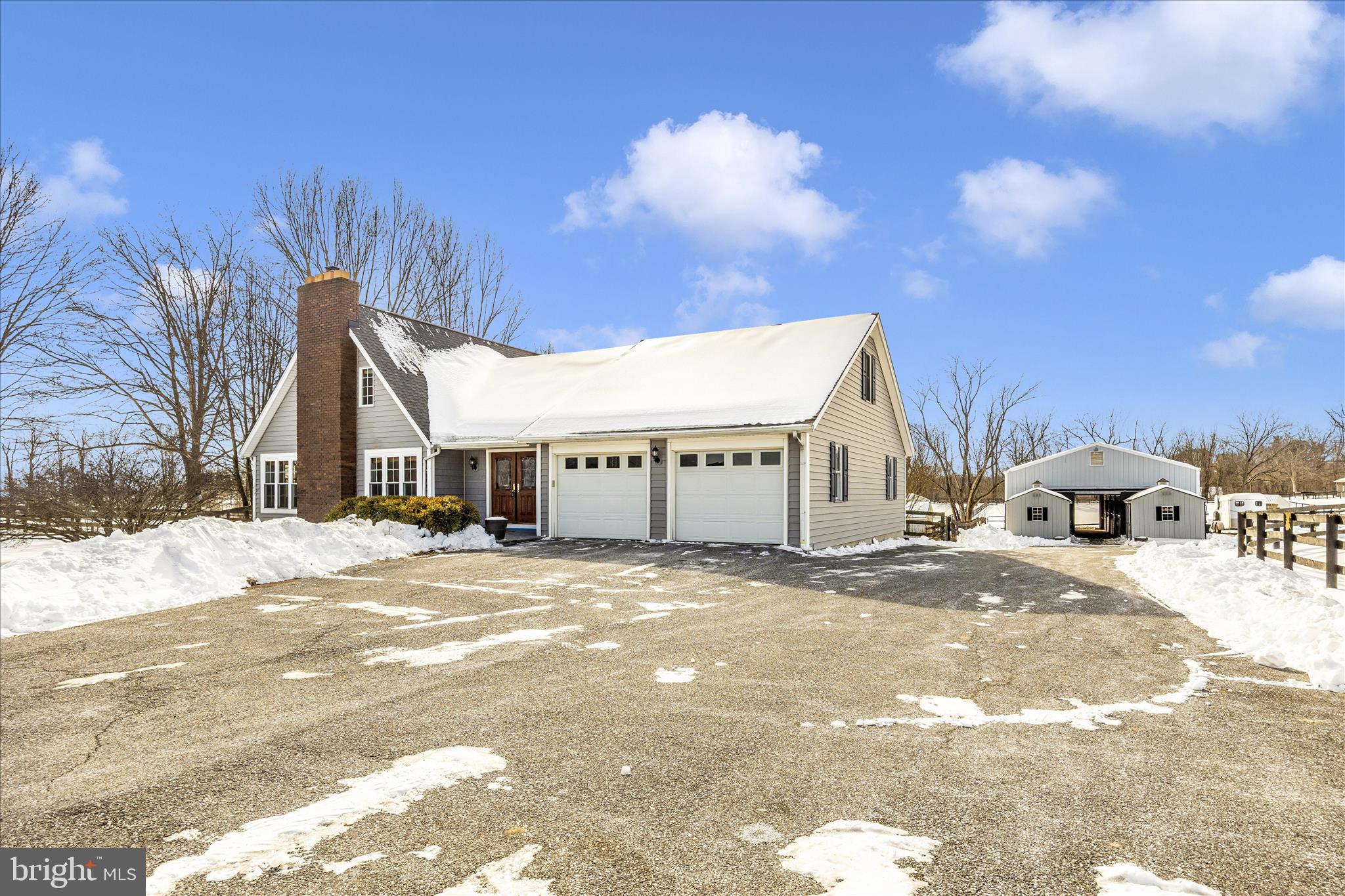 3340 Florence Road Woodbine, MD 21797 - Photo 2 of 61 a view of a house with snow on the road