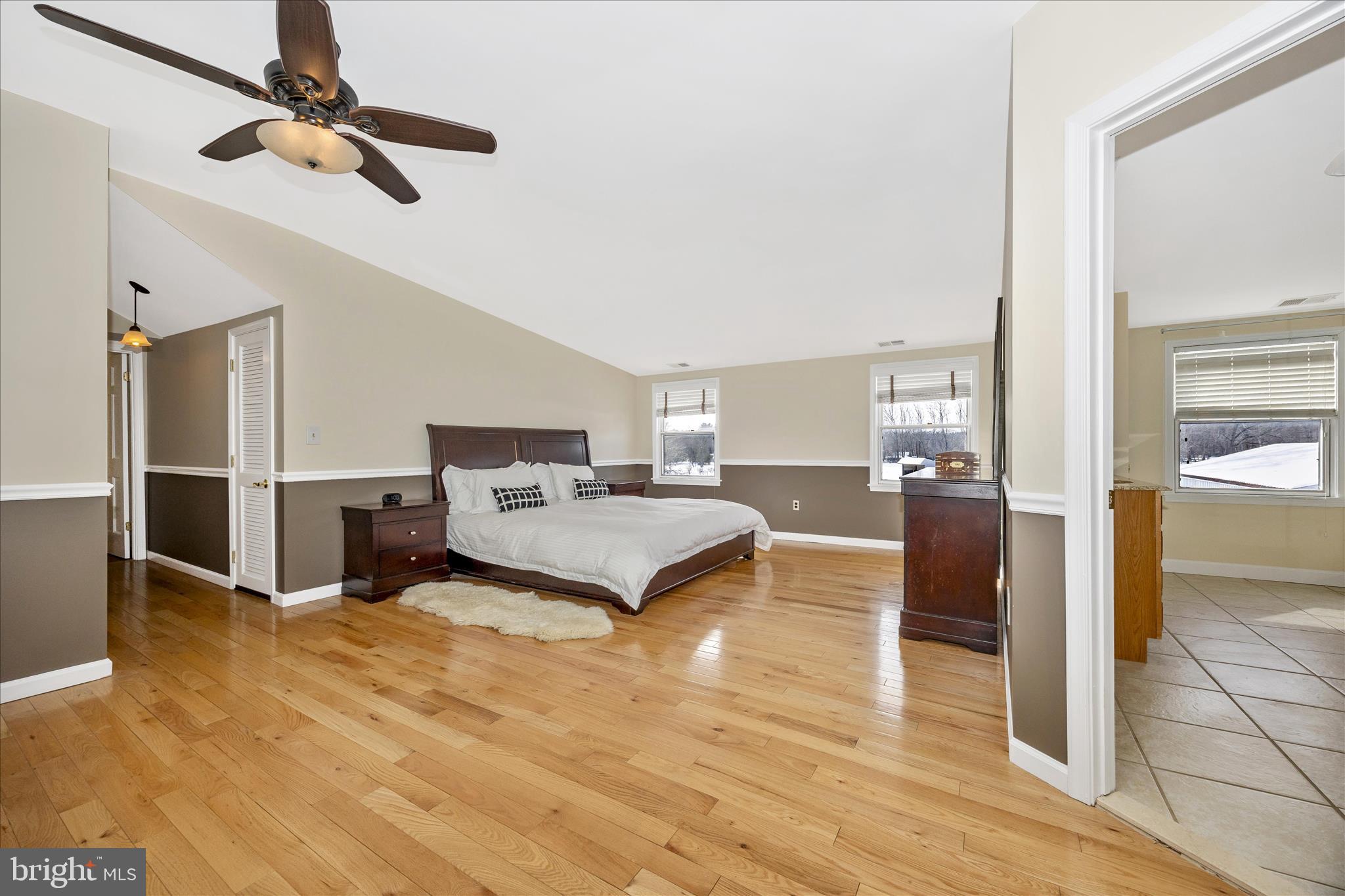 3340 Florence Road Woodbine, MD 21797 - Photo 22 of 61 a bedroom with a bed and a chandelier