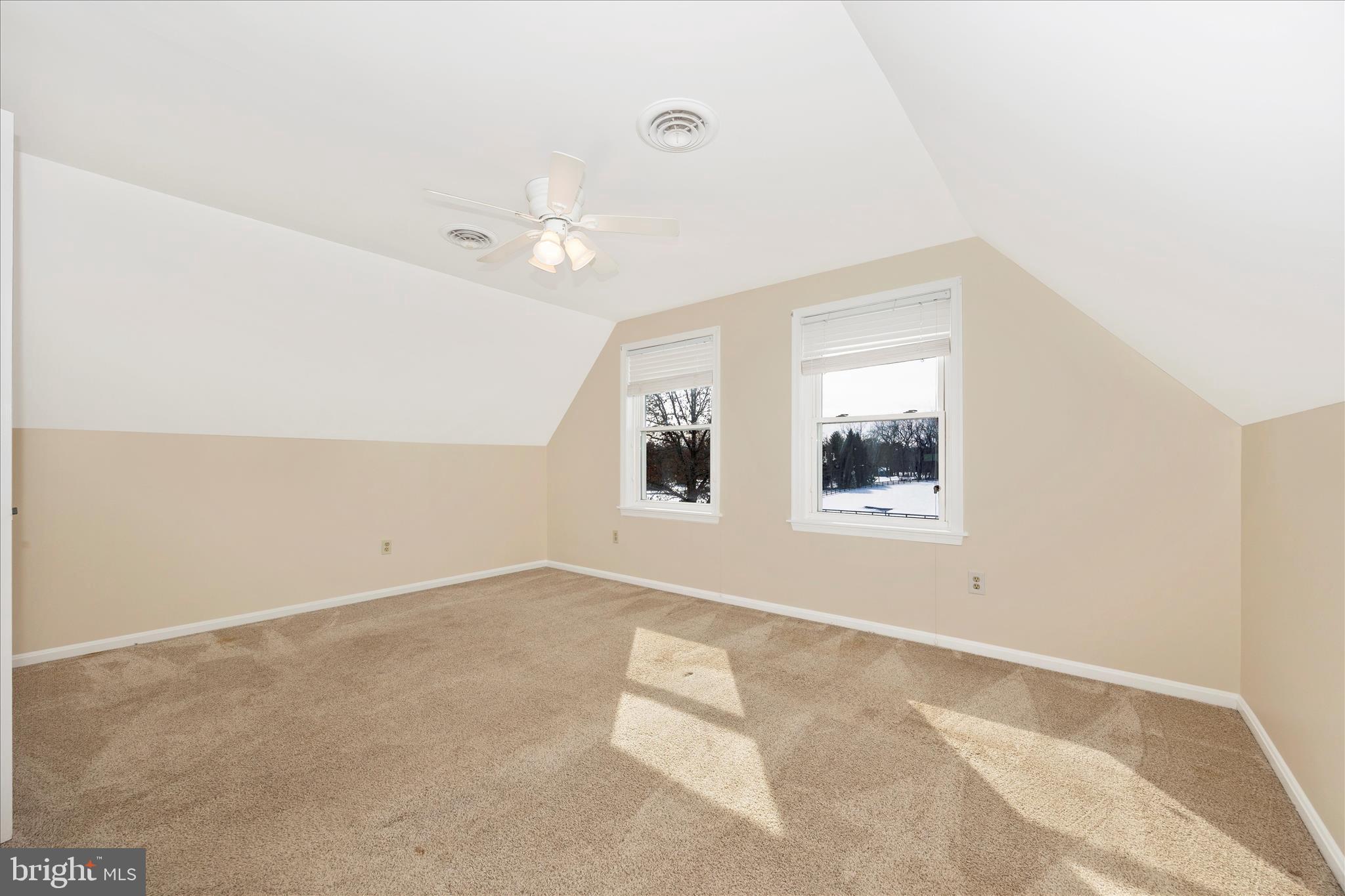 3340 Florence Road Woodbine, MD 21797 - Photo 28 of 61 an empty room with a windows and chandelier fan