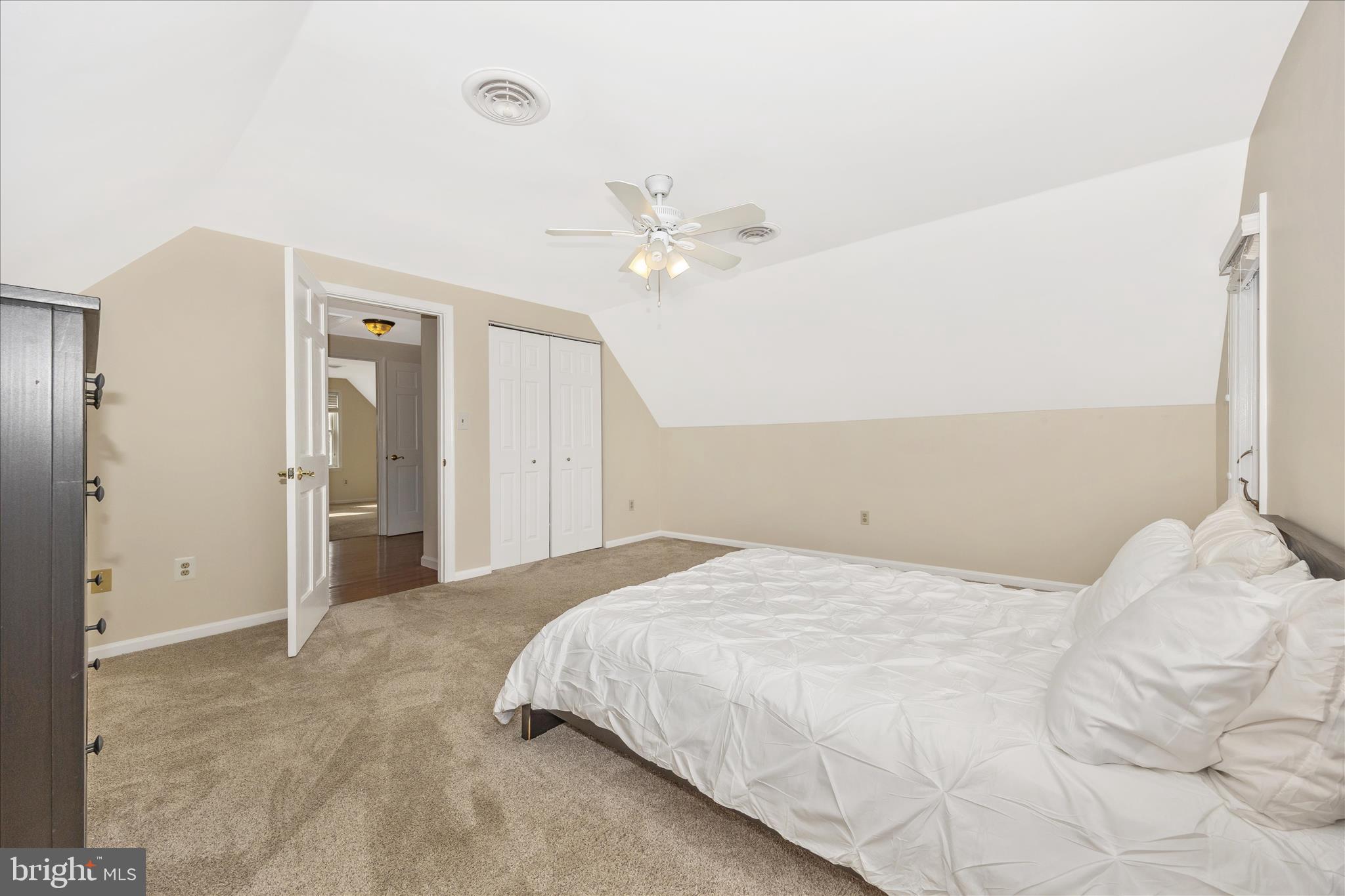 3340 Florence Road Woodbine, MD 21797 - Photo 31 of 61 a bedroom with a large bed and a ceiling fan