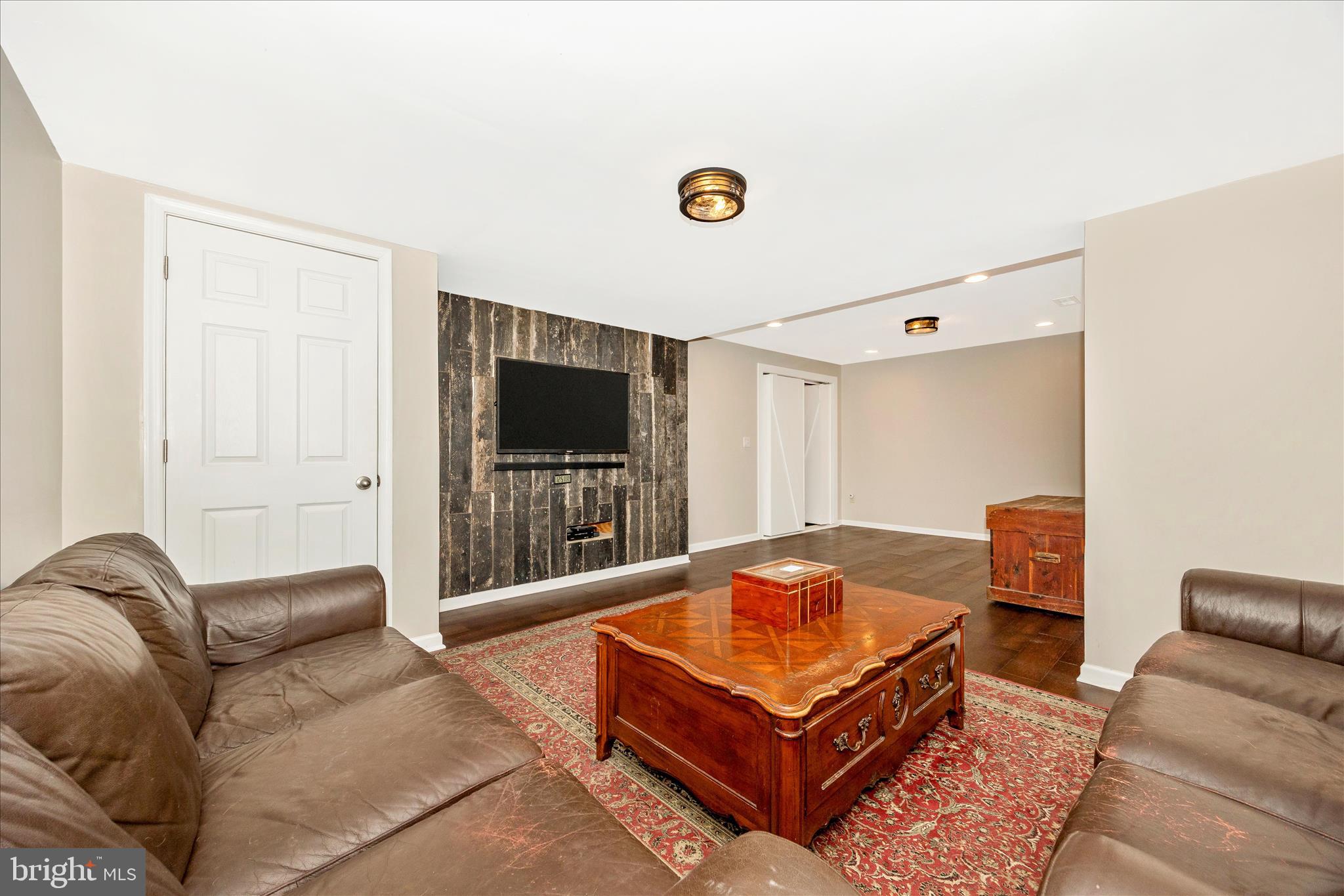 3340 Florence Road Woodbine, MD 21797 - Photo 36 of 61 a living room with furniture and a flat screen tv