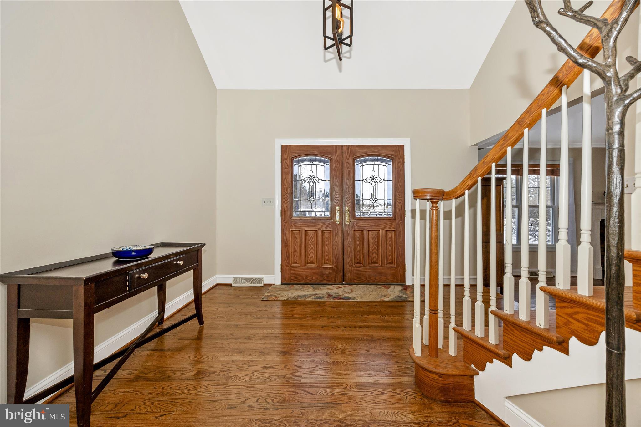 3340 Florence Road Woodbine, MD 21797 - Photo 4 of 61 a view of a hallway with wooden floor and staircase