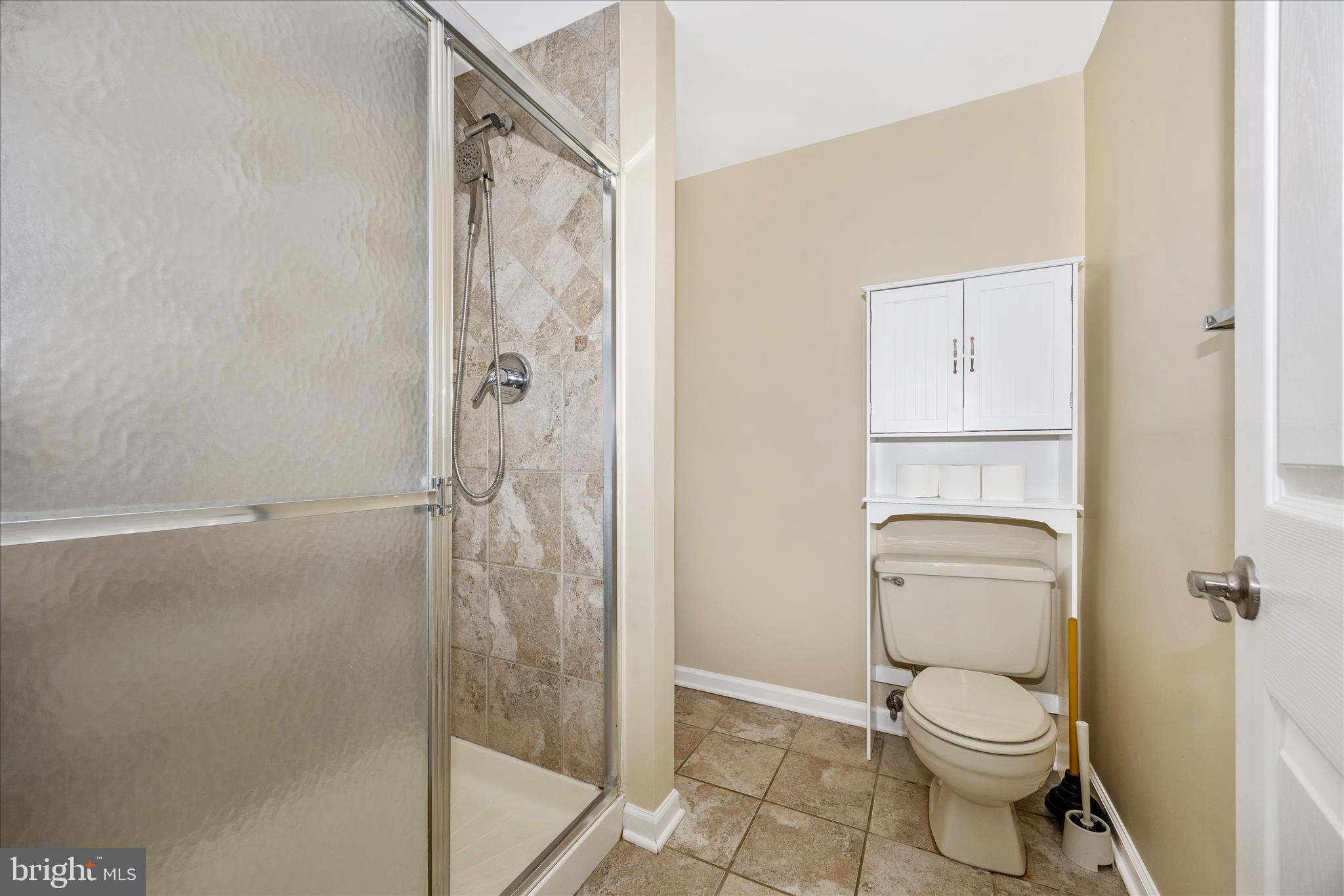 3340 Florence Road Woodbine, MD 21797 - Photo 42 of 61 a white toilet sitting next to a bathroom sink