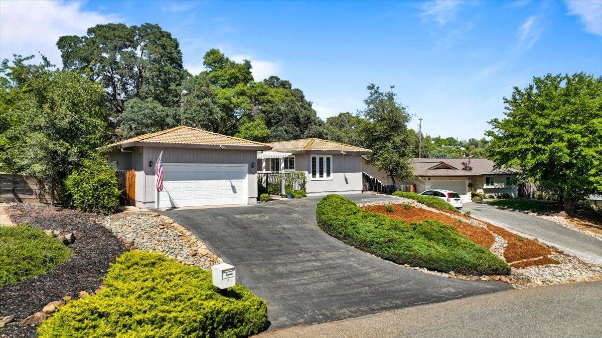 Great curb appeal with a large driveway and low maintenance yard.