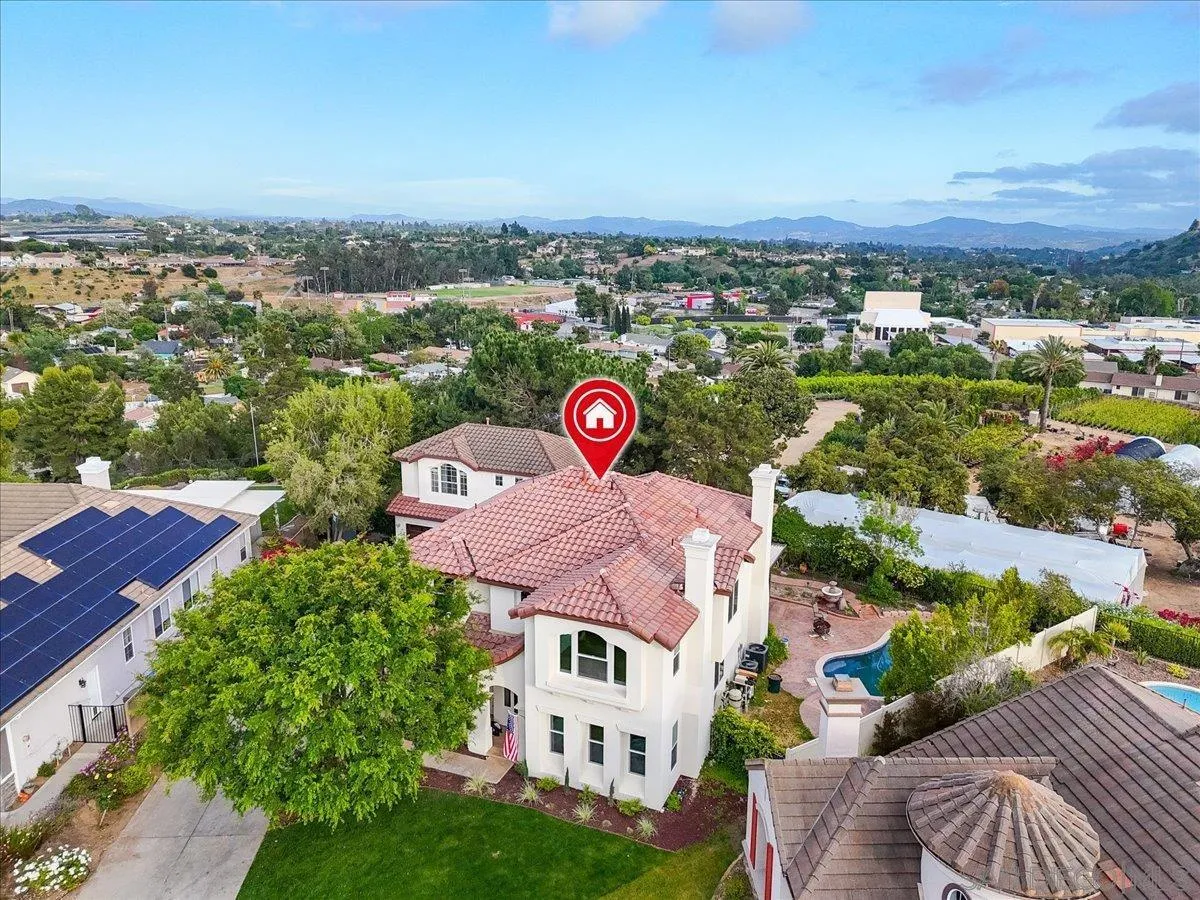 an aerial view of a house with a garden