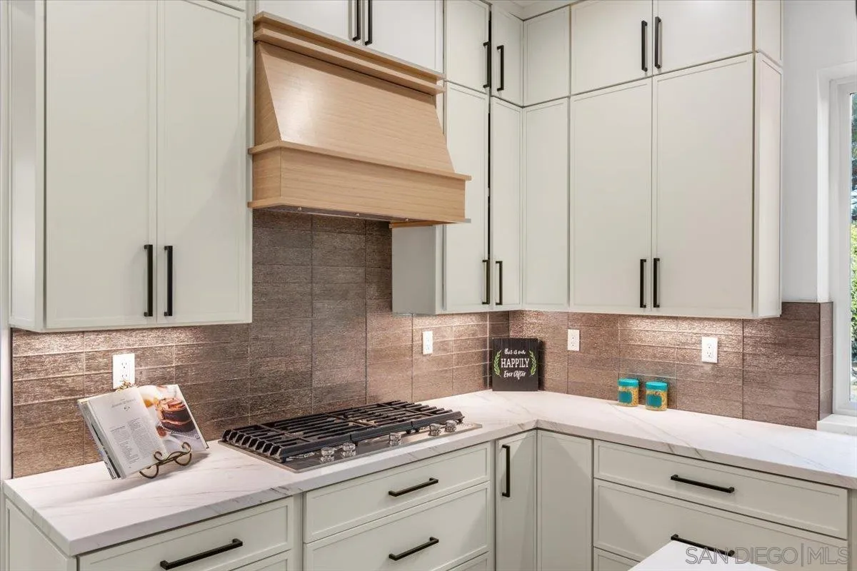 2196 Kirkcaldy Road Fallbrook, CA 92028 - Photo 12 of 57 a kitchen with stainless steel appliances granite countertop a sink a stove and cabinets