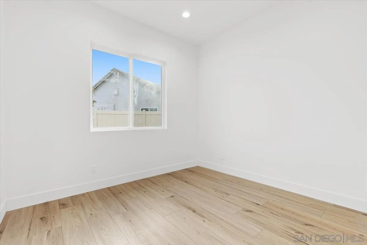 2196 Kirkcaldy Road Fallbrook, CA 92028 - Photo 18 of 57 a view of empty room with wooden floor and fan