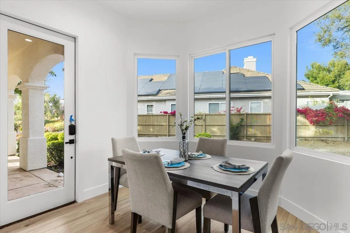 2196 Kirkcaldy Road Fallbrook, CA 92028 - Photo 20 of 57 a view of a dining room with furniture window and wooden floor