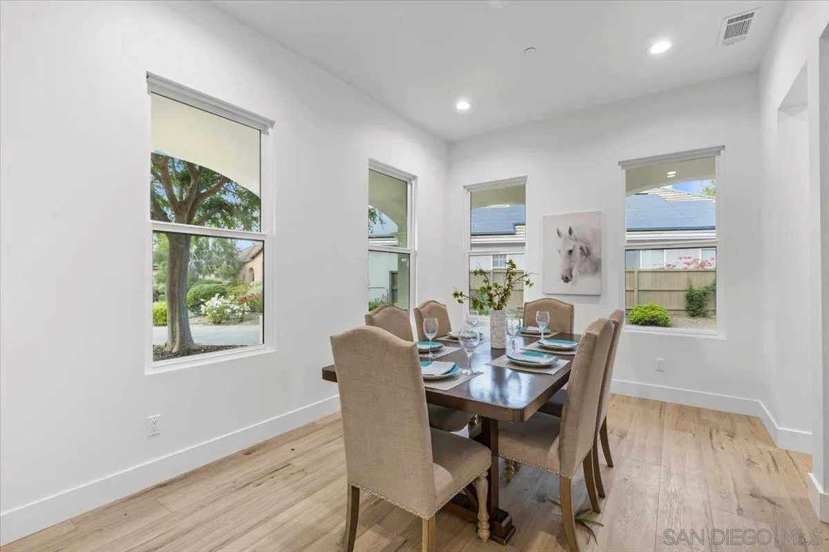 2196 Kirkcaldy Road Fallbrook, CA 92028 - Photo 22 of 57 a view of a dining room with furniture window and wooden floor