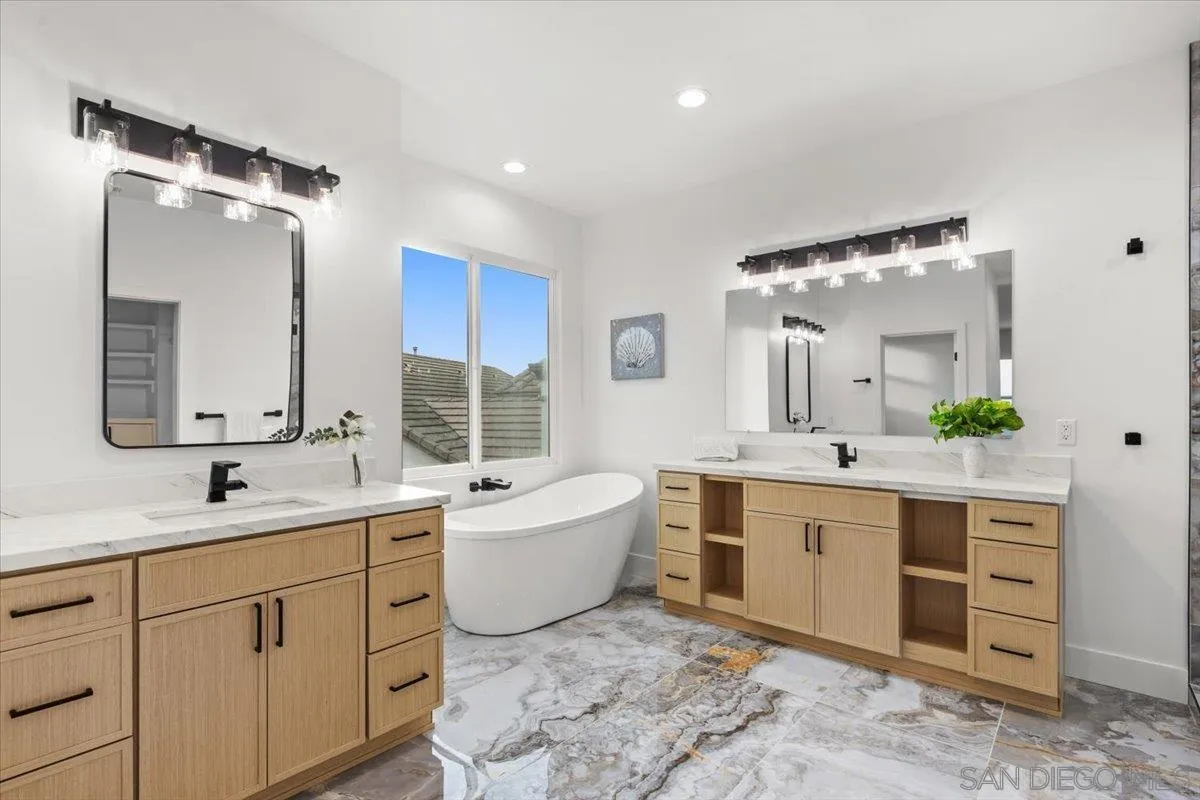 2196 Kirkcaldy Road Fallbrook, CA 92028 - Photo 26 of 57 a bathroom with a double vanity sink mirror and bathtub