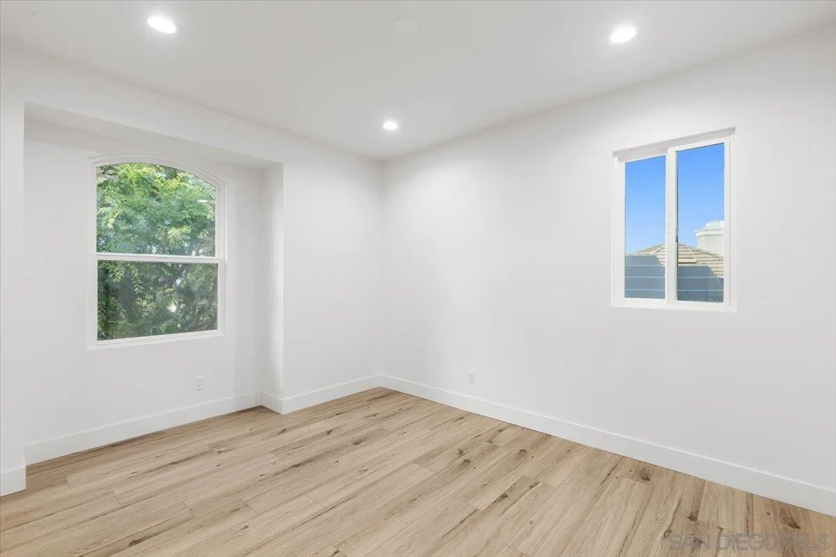 2196 Kirkcaldy Road Fallbrook, CA 92028 - Photo 32 of 57 an empty room with wooden floor and windows