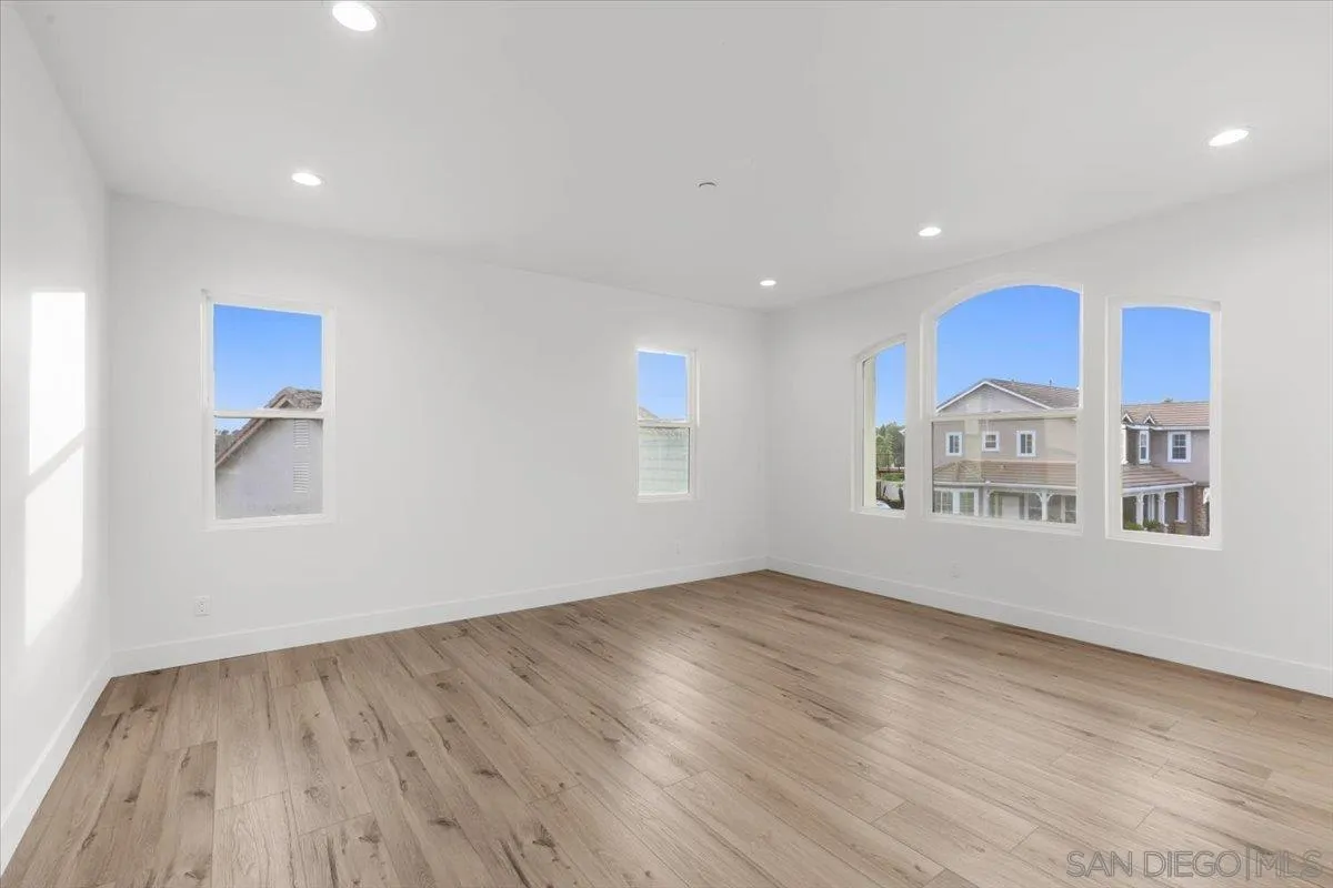 2196 Kirkcaldy Road Fallbrook, CA 92028 - Photo 34 of 57 a view of an empty room with wooden floor and a window