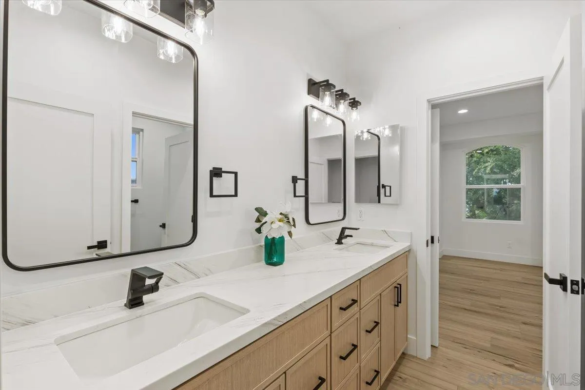 2196 Kirkcaldy Road Fallbrook, CA 92028 - Photo 36 of 57 a bathroom with a double vanity sink mirror and double