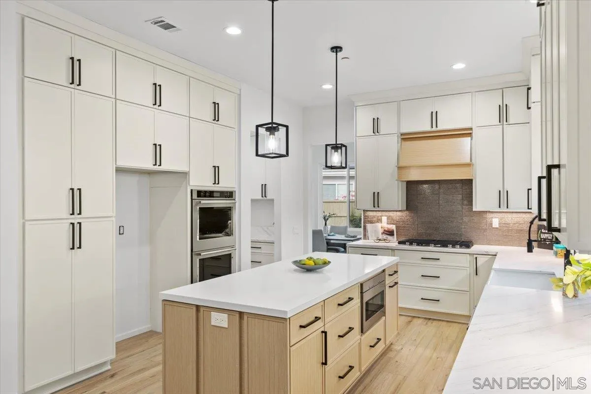 2196 Kirkcaldy Road Fallbrook, CA 92028 - Photo 8 of 57 a kitchen with a sink a counter and stainless steel appliances
