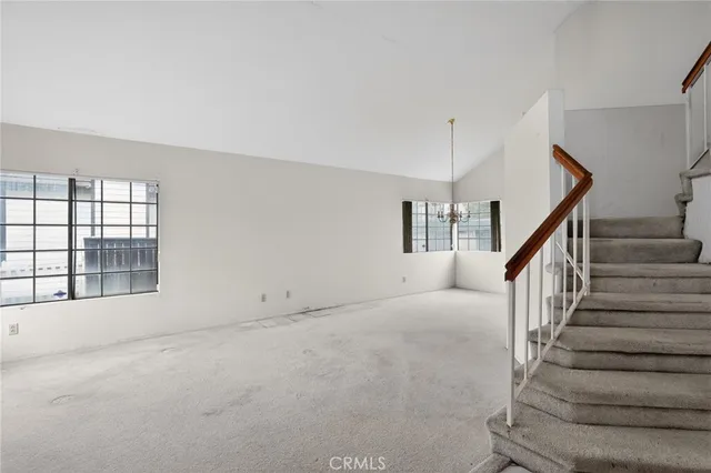 a view of an empty room with stairs