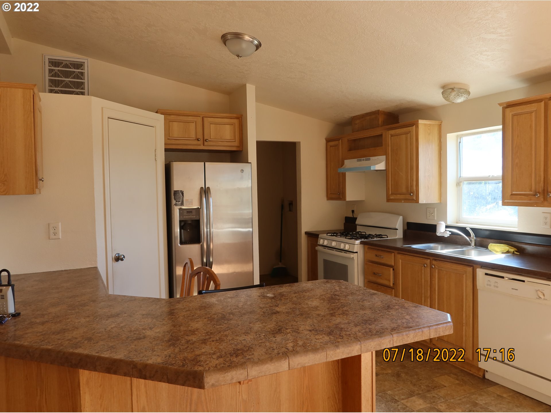 4315 Cordon Road Northeast Salem, OR 97305 - Photo 3 of 11 a kitchen with stainless steel appliances granite countertop a sink stove and refrigerator