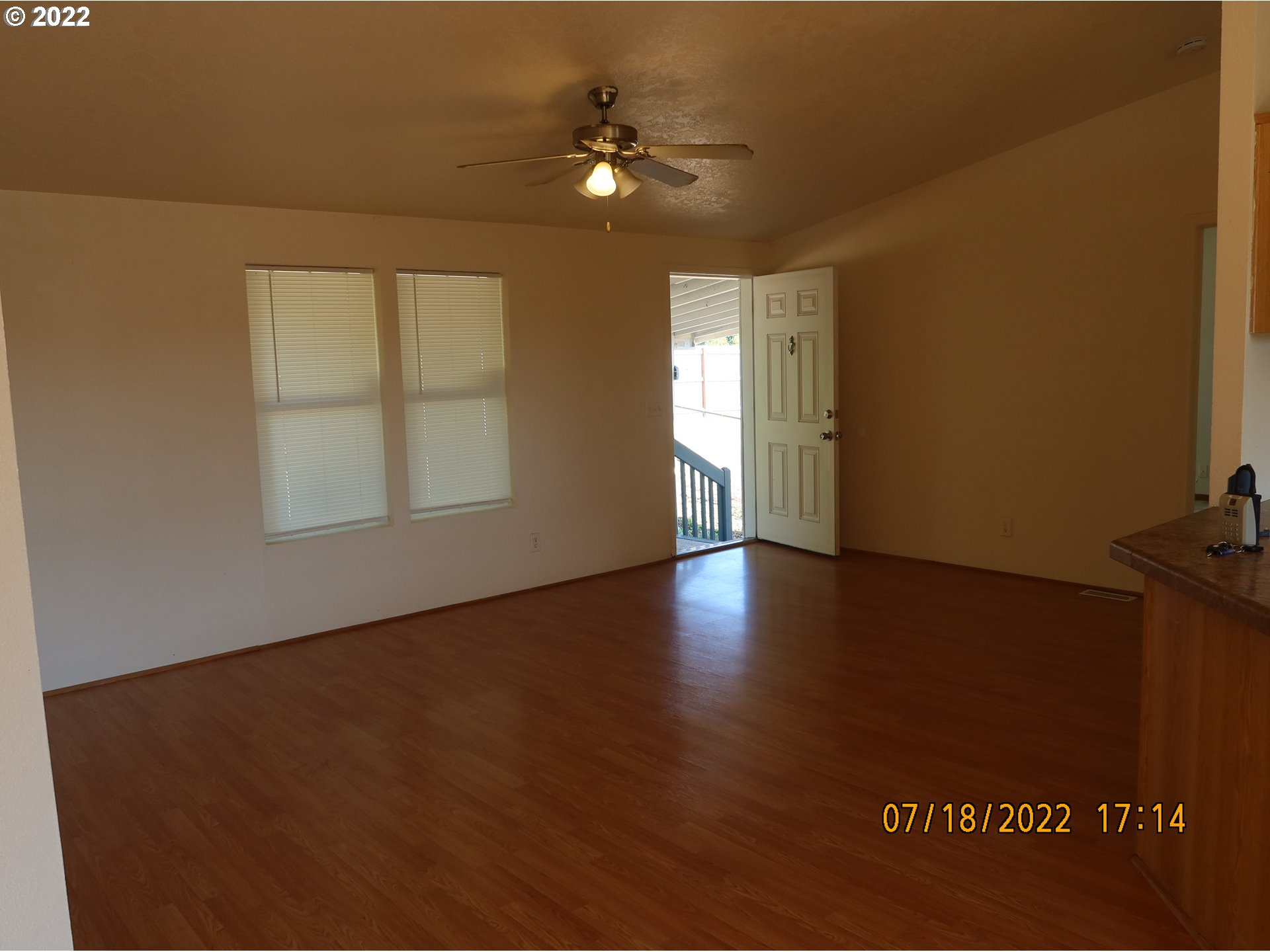 4315 Cordon Road Northeast Salem, OR 97305 - Photo 8 of 11 an empty room with windows and ceiling fan