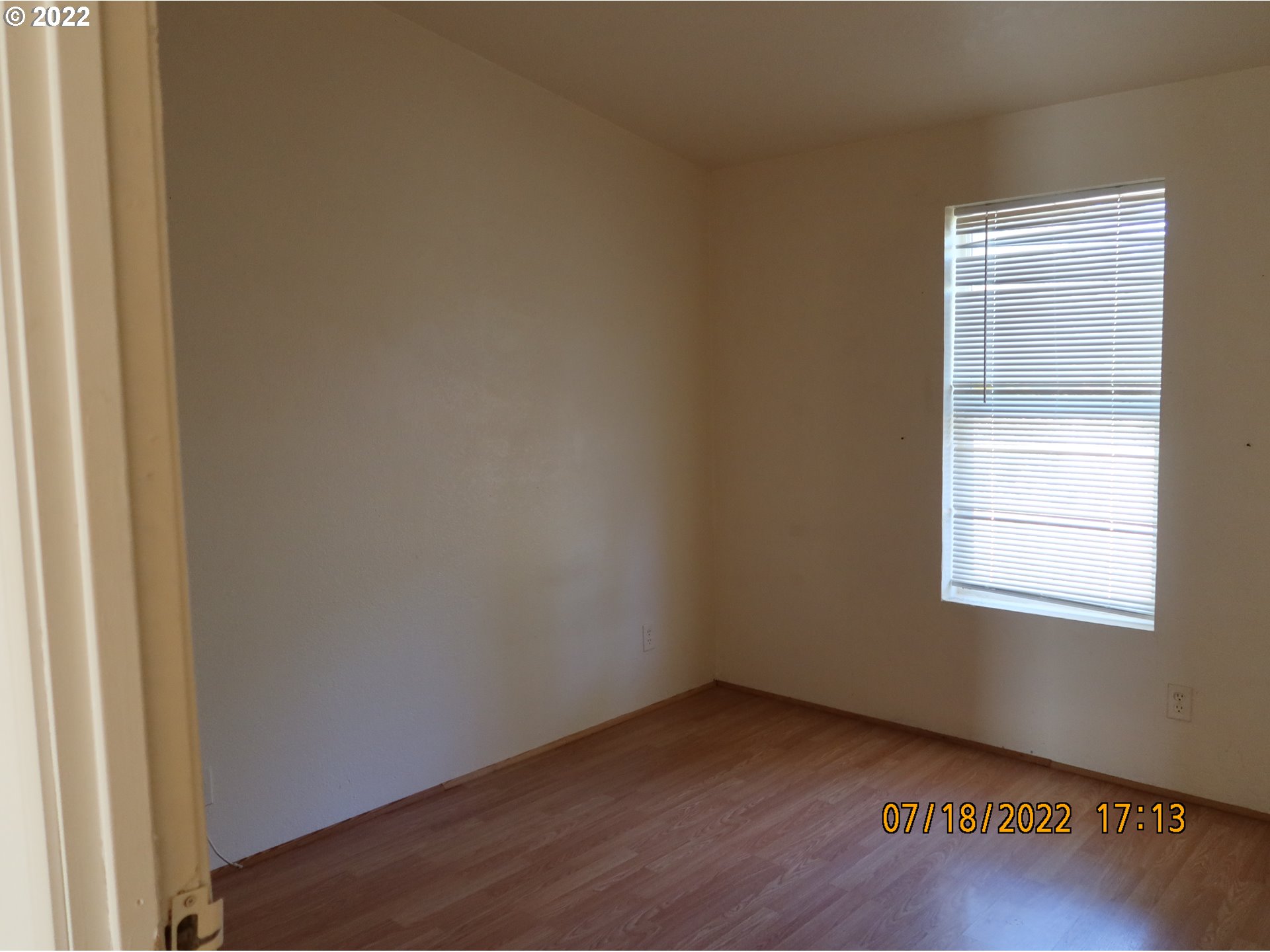 4315 Cordon Road Northeast Salem, OR 97305 - Photo 9 of 11 an empty room with wooden floor and windows
