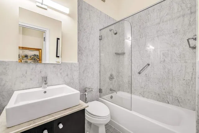 a bedroom with a large bed and a large window