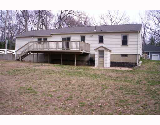 303 Angell Road Lincoln, RI 02865 - Photo 2 of 9 Exterior Back. Spacious deck for entertaining, nice useable leveled yard. Plant your garden here!