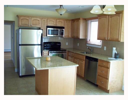 303 Angell Road Lincoln, RI 02865 - Photo 3 of 9 Kitchen. New Stainless Steel appliances can be found here in this sunny kitchen. Handsome granite counters carefully selected to match any decor.