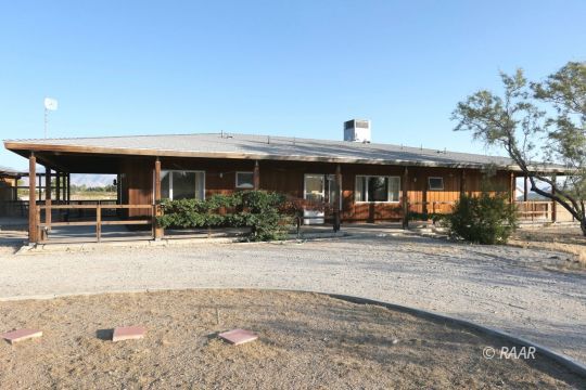 237 North Alford Street Ridgecrest, CA 93555 - Photo 1 of 35 a front view of house with yard outdoor seating and large tree